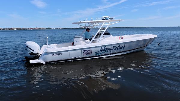 Intrepid 327 CC 2012 Intrepid 327 CC boat named "Johnny Be Good" on calm water.