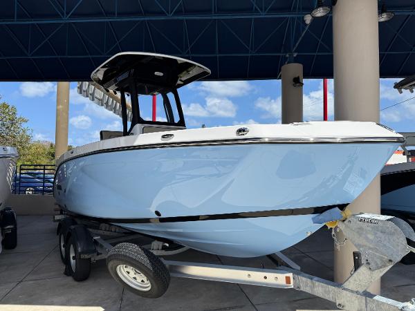 Yamaha Boats 222 FSH Sport E 2025 Yamaha Boats 222 FSH Sport E in light blue on trailer, under canopy.
