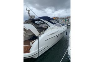 Gobbi 425 SC 2004 Gobbi 425 SC yacht docked in marina under cloudy sky.