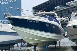 Formula 330 Sun Sport 2004 Formula 330 Sun Sport boat docked at a marina, blue and white exterior.