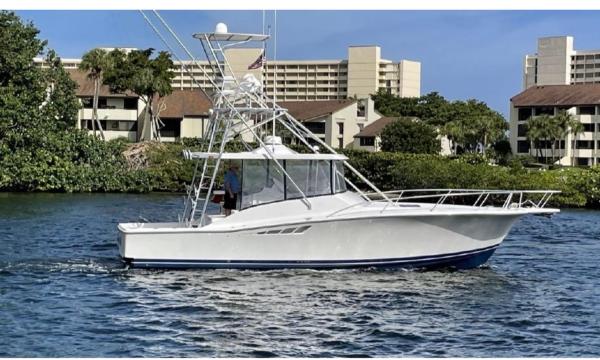 Luhrs 40 Open 1998 Luhrs 40 Open boat cruising on a scenic waterway.