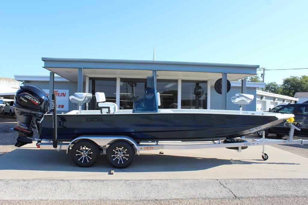 Excel Bay Pro Elite 220 2026 Excel Bay Pro Elite 220 boat on trailer, parked outside dealership.