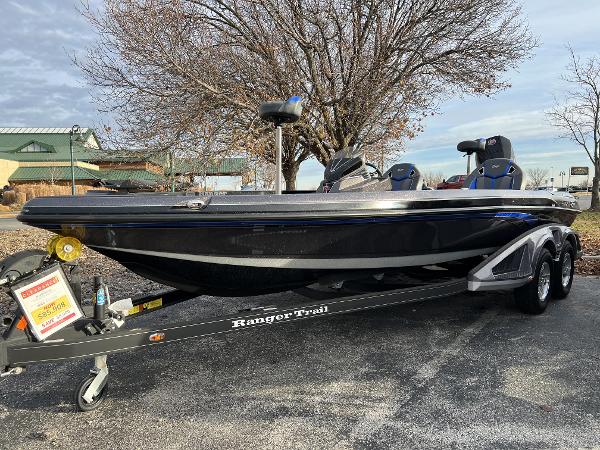 Ranger Z520R 2023 Ranger Z520R bass boat on a Ranger Trail trailer in a parking lot.