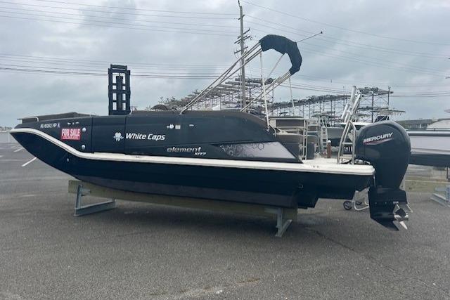 Bayliner Element XR7 2021 Bayliner Element XR7 boat for sale, parked on a lot with overcast skies.