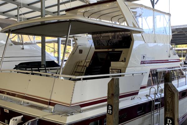 Trojan F 40 1982 Trojan F 40 yacht docked in a covered marina.