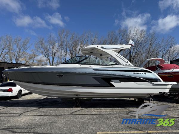 Formula 330 Crossover Bowrider I/O 2025 Formula 330 Crossover Bowrider I/O boat displayed outdoors on a sunny day.
