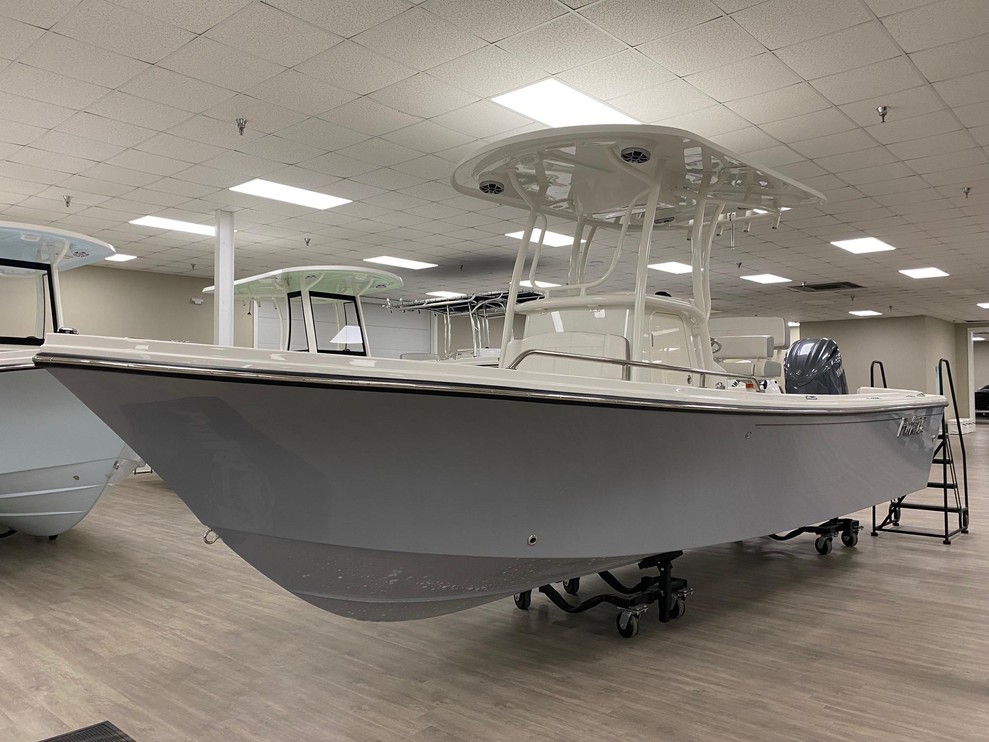 Parker 2300 Special Edition 2024 Parker 2300 SE boat displayed indoors on a showroom floor.