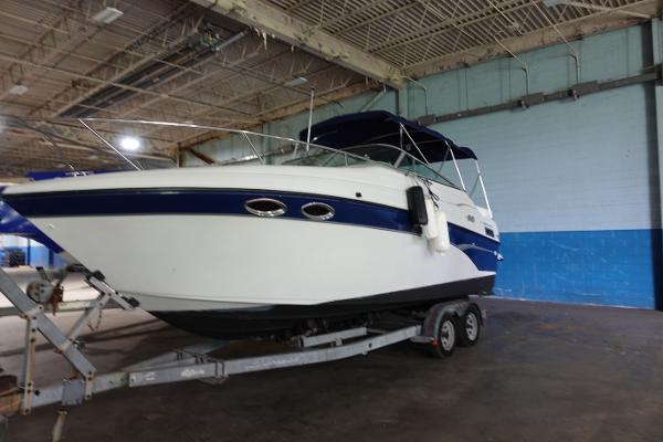 Crownline 262 CR 2001 Crownline 262 CR boat on trailer in indoor storage facility.