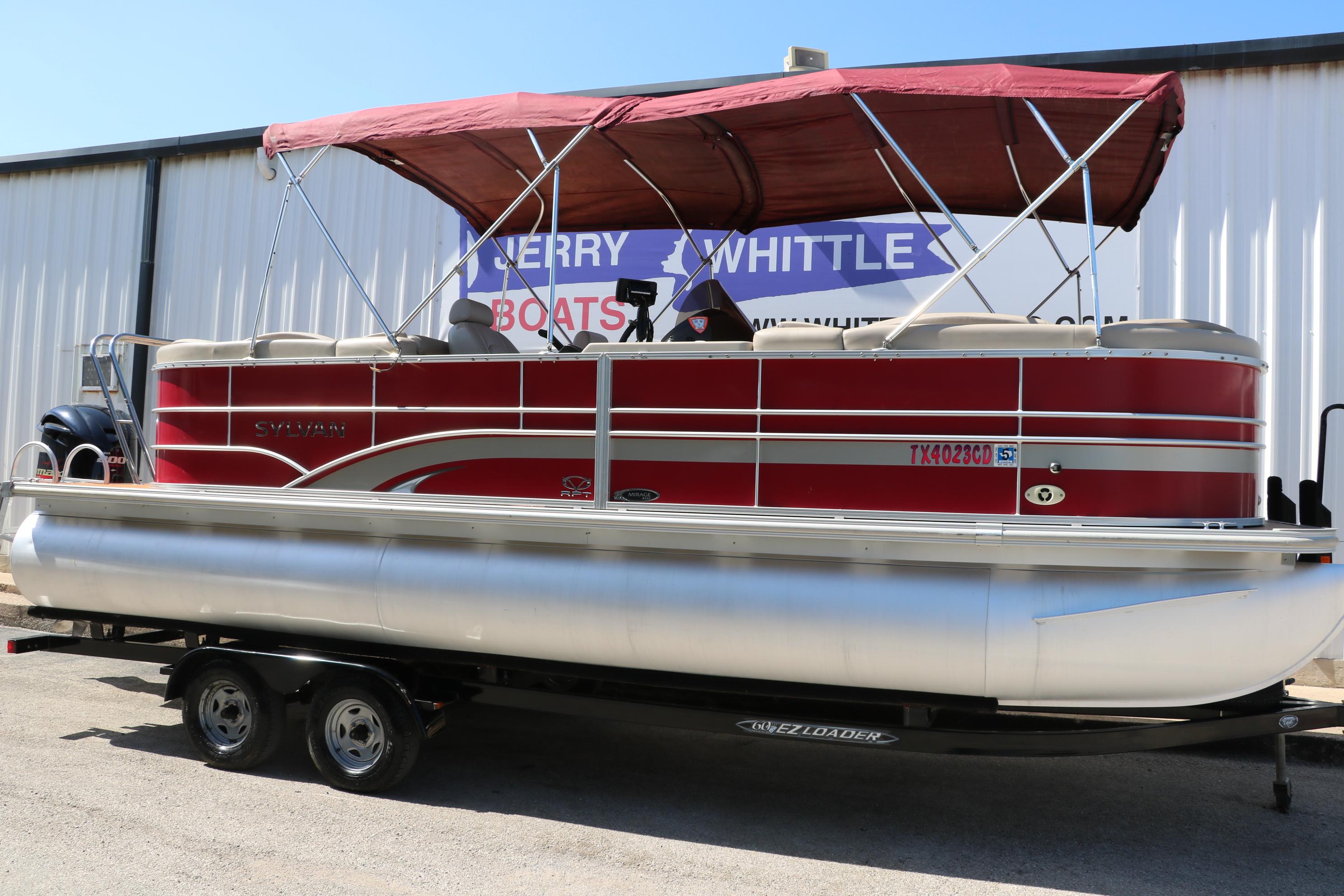 Sylvan Mirage 8522 Mirage 2013 Sylvan Mirage 8522 pontoon boat with red canopy on trailer.
