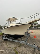 Parker 2300 Center Console 1996 Parker 2300 DV Center Console boat on trailer in parking lot.