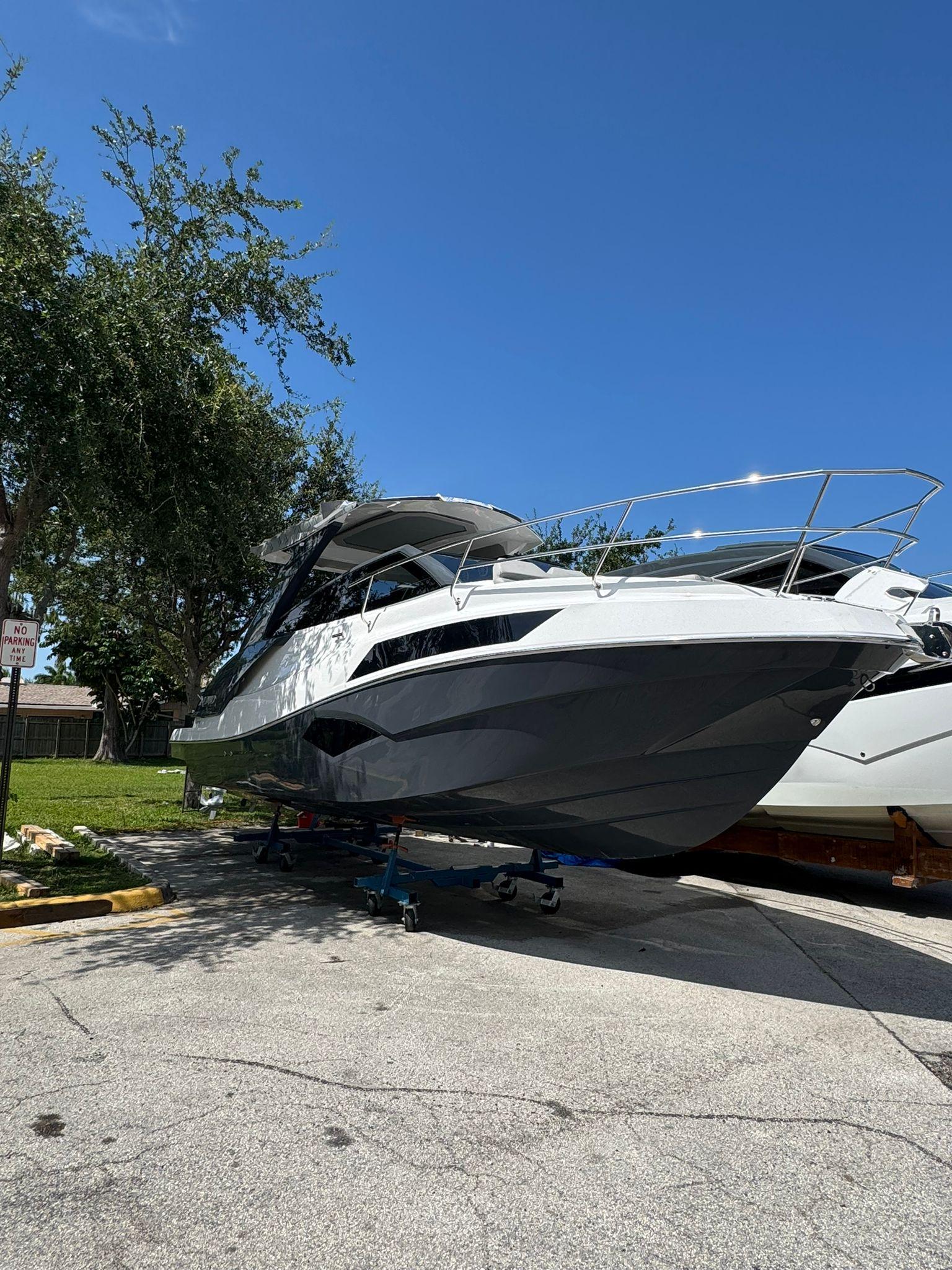 NX Boats NX340 2025 NX Boats NX340 yacht on display under clear blue sky.