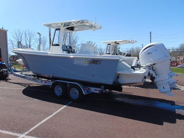 Parker 2600 CC 2025 Parker 2600 CC boat on trailer, featuring dual outboard engines.