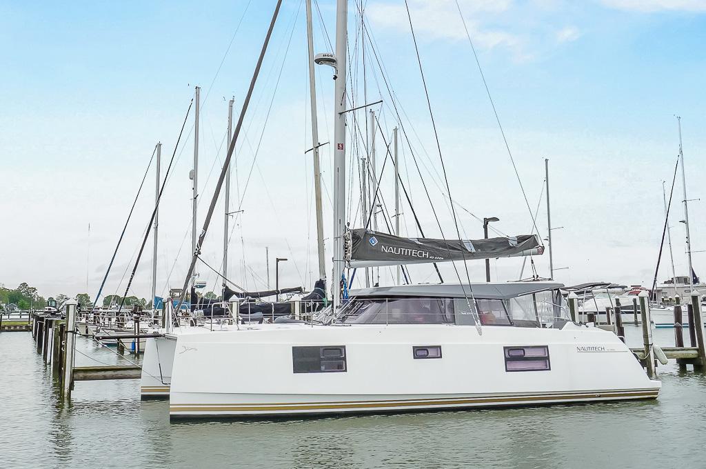 Nautitech 40 Open 2022 Nautitech 40 Open catamaran docked at a marina under a clear sky.