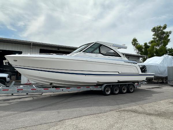 Formula 380 SSC 2021 Formula 380 SSC boat on a trailer in a marina.