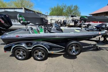 Ranger Z519 2019 Ranger Z519 boat with dual-axle trailer, parked outdoors.