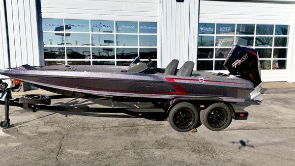 iKon VLX20 2025 iKon VLX20 boat on trailer outside a garage.