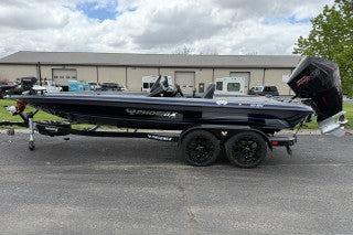 Phoenix 921 ELITE 2025 Phoenix 921 ELITE boat on trailer, parked outdoors, with overcast sky.