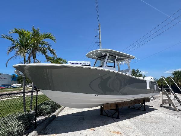 Sportsman Open 282 Center Console 2025 Sportsman 282 Open boat displayed outdoors under clear blue sky.