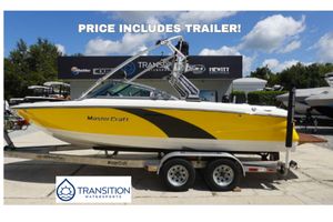 MasterCraft X-15 2011 MasterCraft X-15 boat in yellow on trailer, available at Transition Watersports.