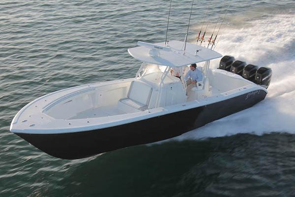 Yellowfin 39 Manufacturer Provided Image: 2015 Yellowfin 39 boat speeding on water with multiple outboard engines.