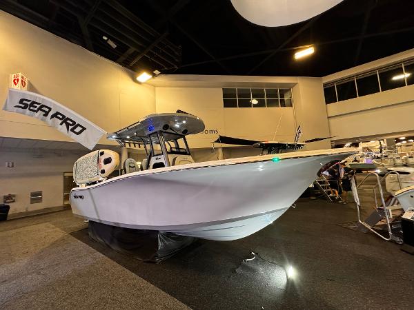 Sea Pro 262 DLX 2025 Sea Pro 262 DLX boat displayed indoors at a showroom.