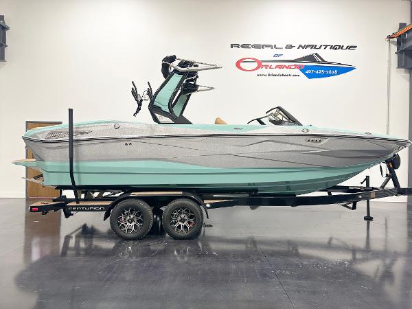 Centurion Nv233 2025 Centurion NV233 boat on trailer in showroom, side view.