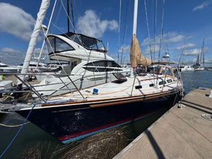 Sabre 362 Sailboat Sabre 362, 2000 model, docked at marina under clear blue sky.