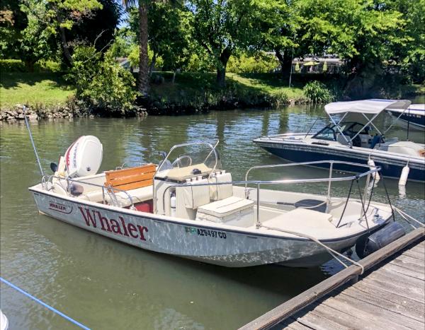 Boston Whaler 17 Montauk 1993 Boston Whaler 17 Montauk boat docked on a sunny day.