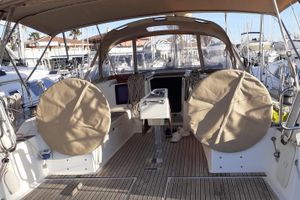 Dufour 382 Grand Large Cockpit of 2015 Dufour 382 Grand Large sailboat with covered steering wheels.