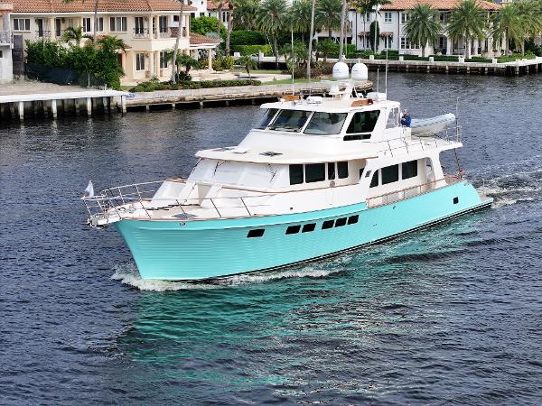 Marlow Explorer 66E 2020 Marlow Explorer 66E yacht cruising on a scenic waterfront.