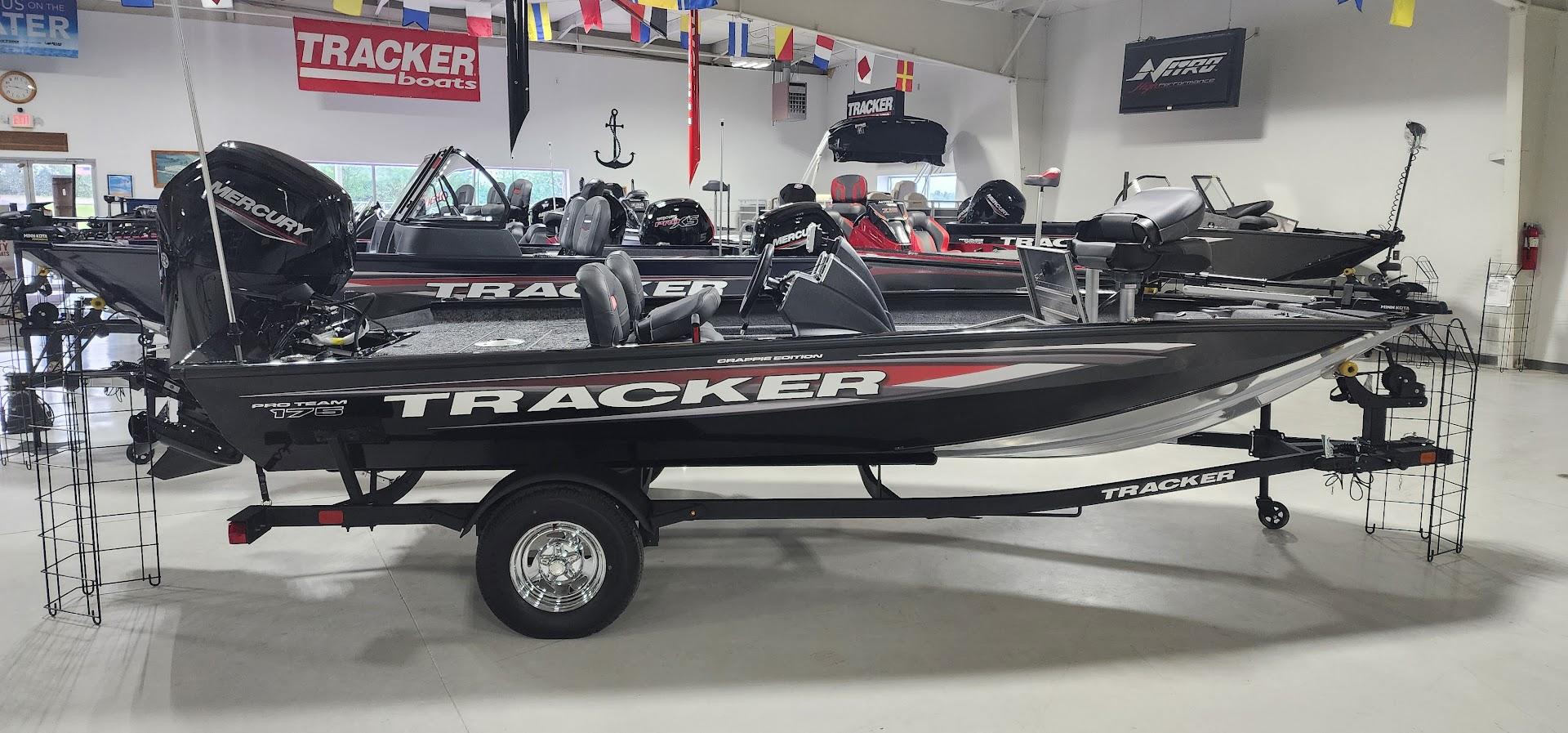 Tracker Pro Team 175 Crappie Edition 2025 Tracker Pro Team 175 Crappie Edition boat displayed indoors with Mercury engine.