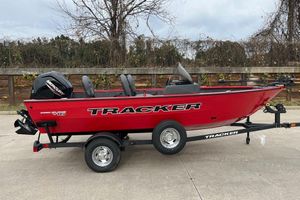Tracker Pro Guide V-16 SC Red 2026 Tracker Pro Guide V-16 SC boat on trailer, parked outdoors.