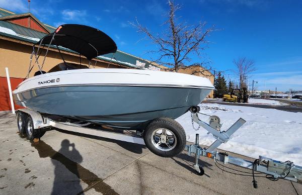 Tahoe T21 2024 Tahoe T21 boat on trailer, parked outdoors on a sunny day.