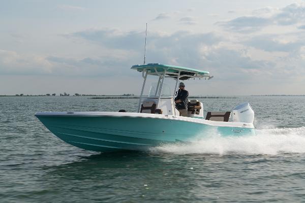 Caymas 28 HB 2024 Caymas 28 Hybrid boat cruising on open water.