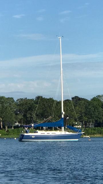 Freedom Freedom 36 1987 Freedom 36 sailboat on calm water with trees in the background.