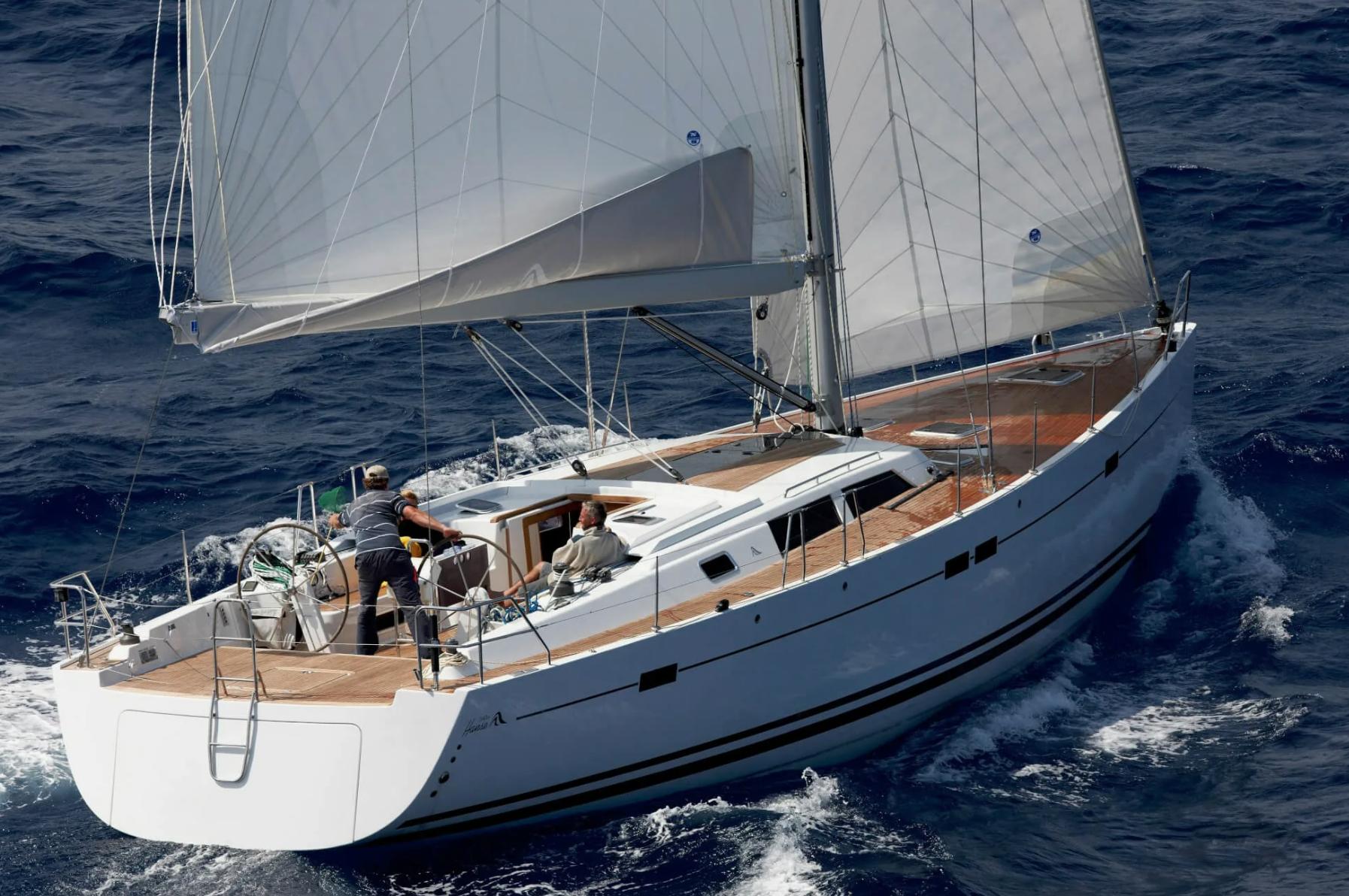 Hanse 540e Sailing yacht Hanse 540e, 2009 model, navigating through ocean waves.