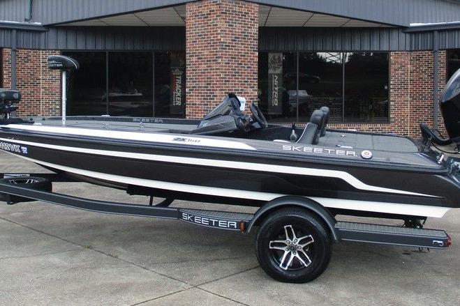Skeeter ZX150 2020 Skeeter ZX150 boat with sleek design parked outside a brick building.