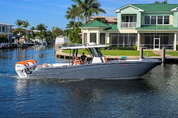World Cat 400 CC-X 2022 World Cat 400 CC-X boat cruising near waterfront homes.