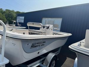 Carolina Skiff 19 LS 2025 Carolina Skiff 19 LS boat on trailer outside showroom.