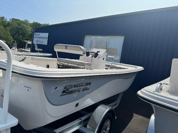 Carolina Skiff 19 LS 2025 Carolina Skiff 19 LS boat on trailer outside showroom.