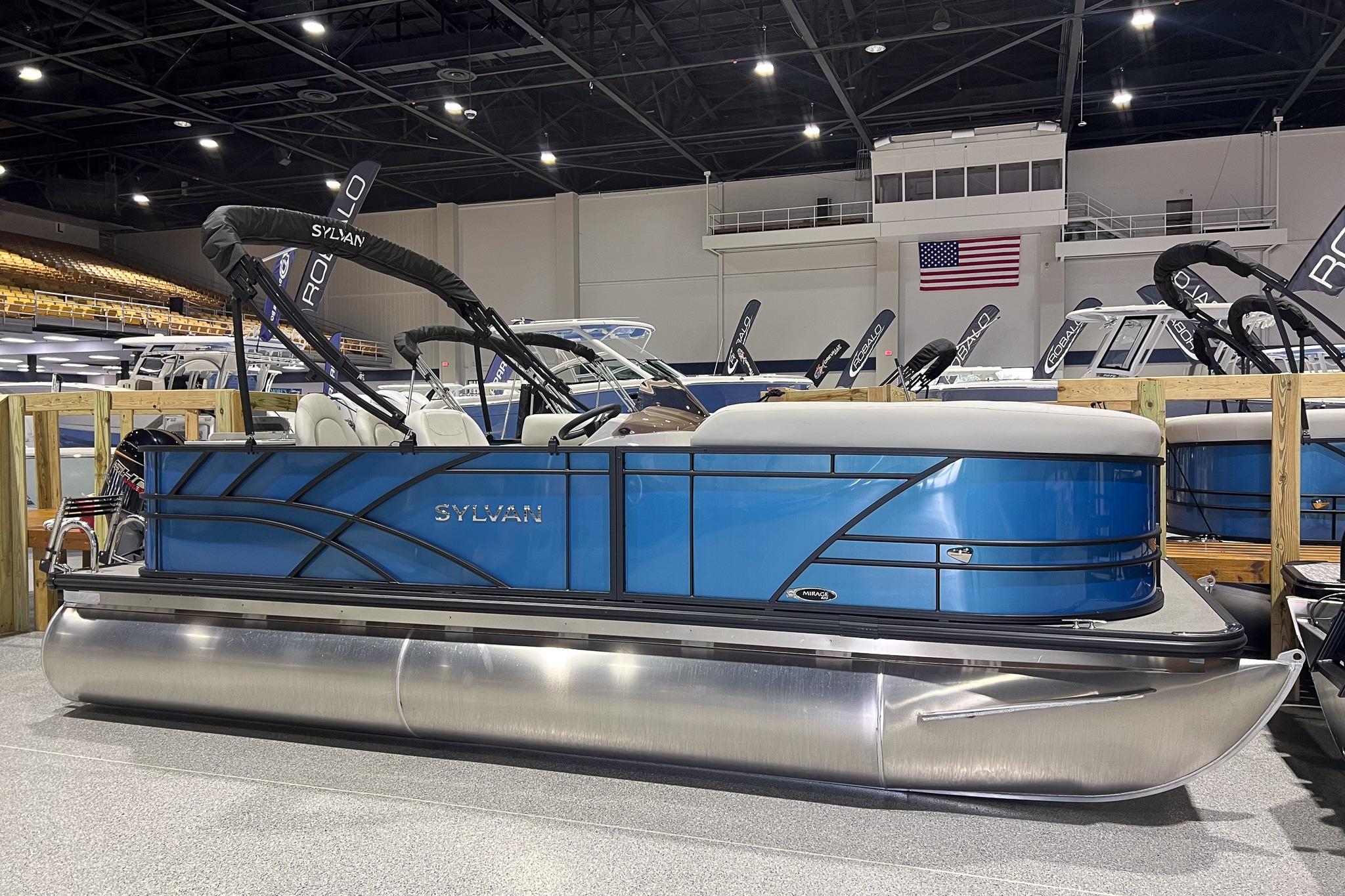 Sylvan Mirage Fish 820 Party Fish 2026 Sylvan Mirage Fish 820 Party Fish pontoon boat displayed indoors.