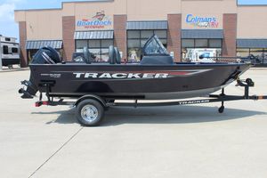 Tracker Pro Guide V-16 WT 2026 Tracker Pro Guide V-16 WT boat on trailer outside dealership.