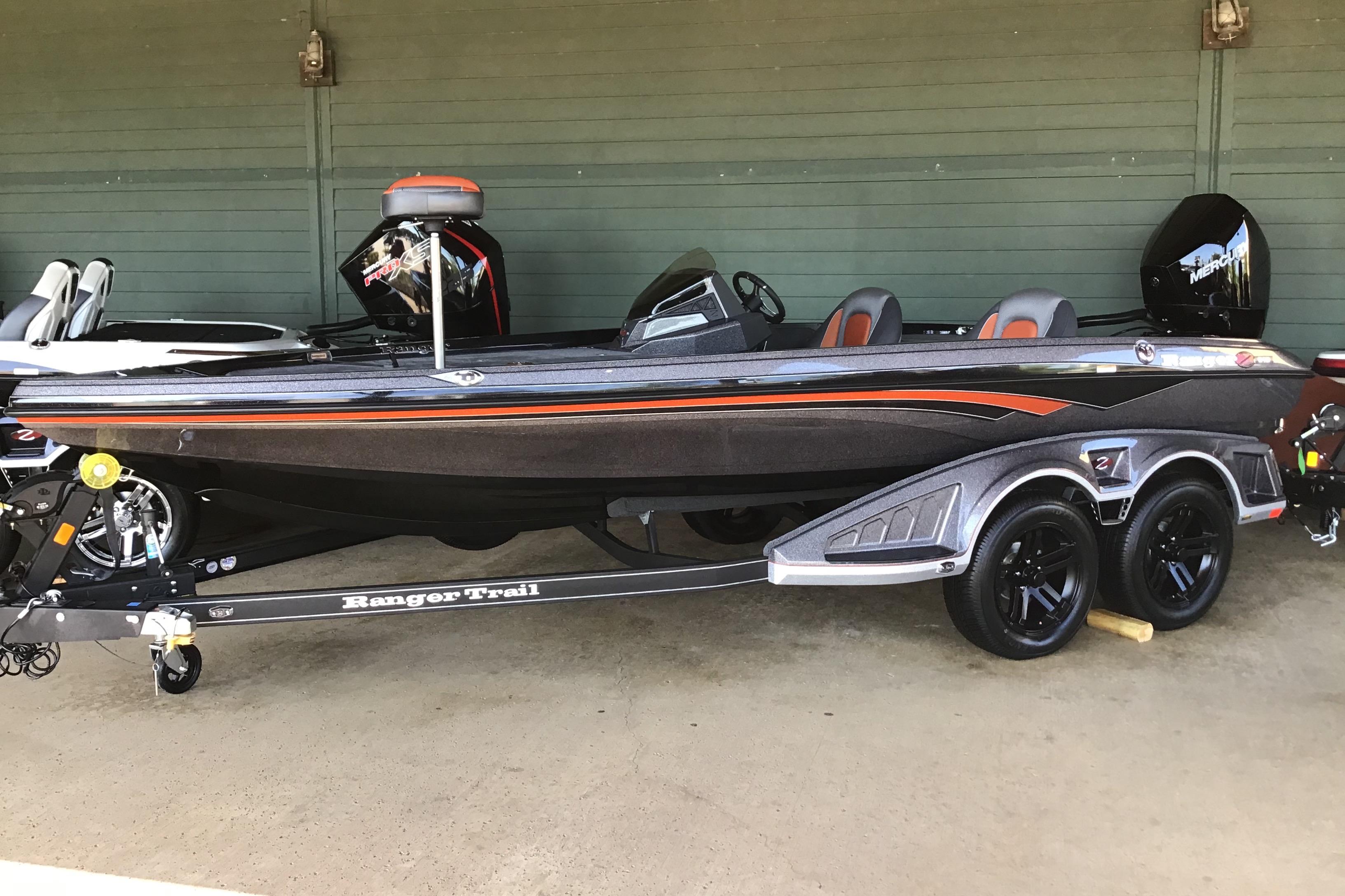 Ranger Z518 2025 Ranger Z518 boat on trailer, sleek design with dual seats and powerful outboard motor.