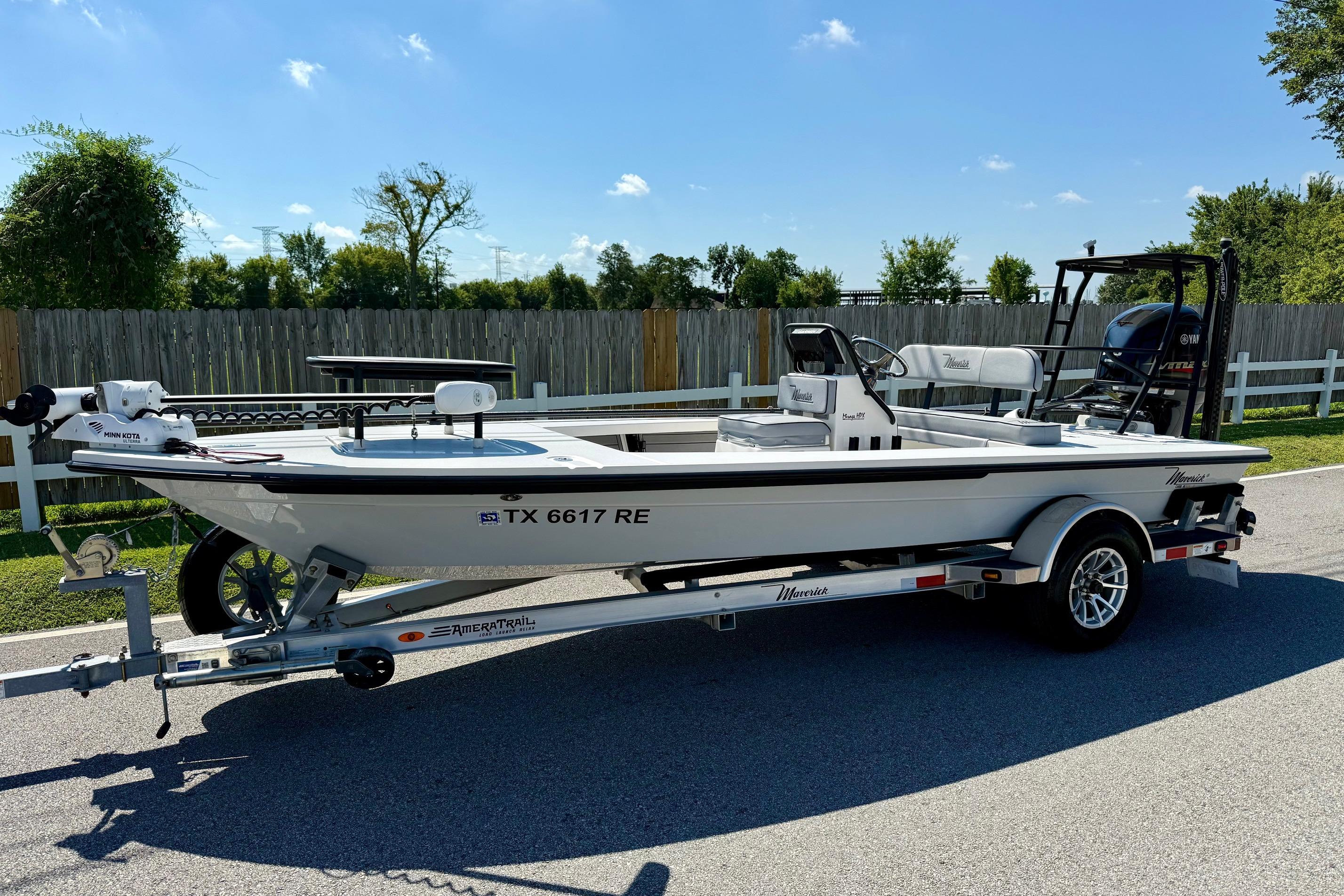 Maverick 18HPX V 2023 Maverick 18HPX V boat on trailer, parked on a sunny street.