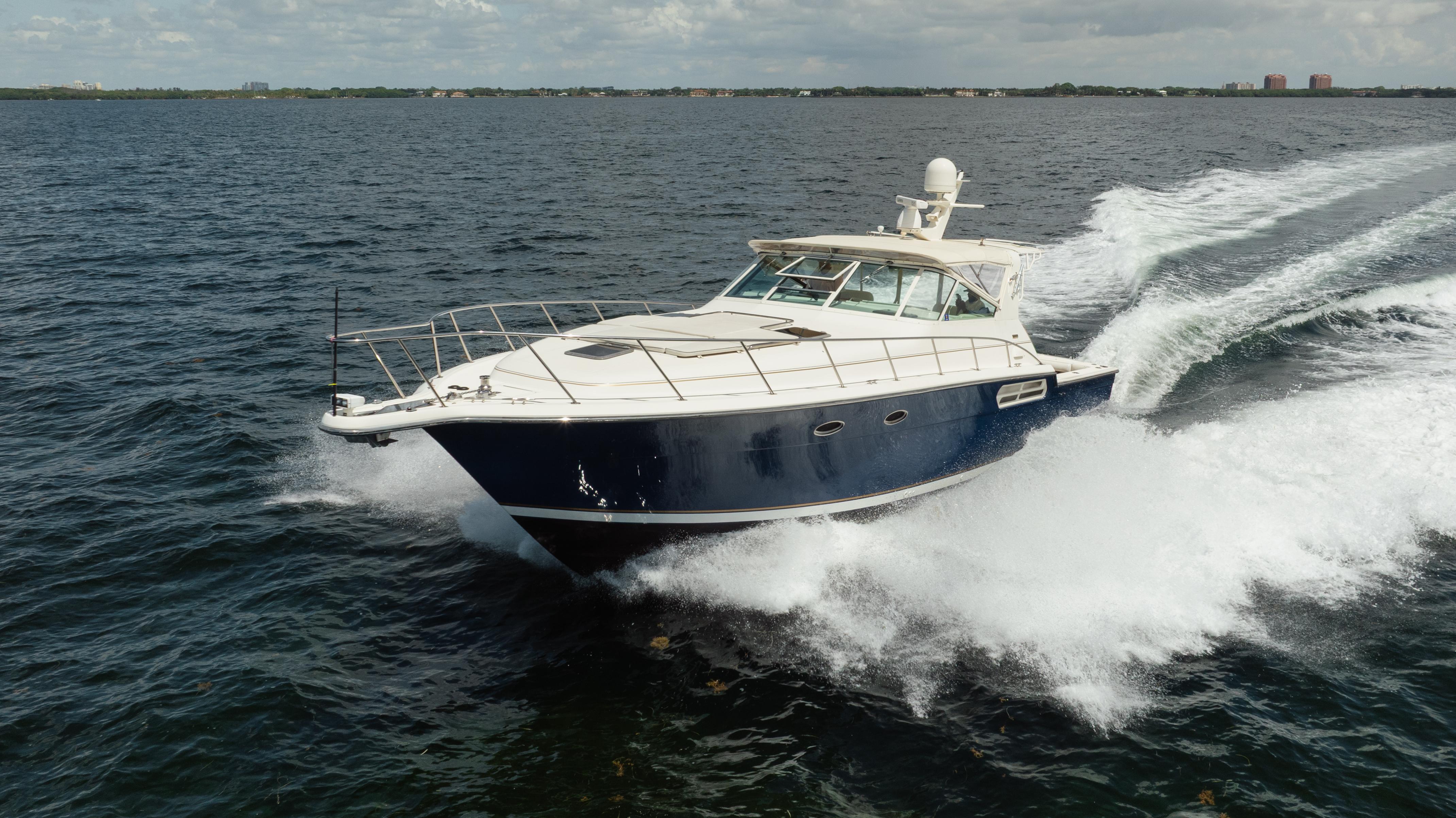 Tiara Yachts 4300 Open 1998 Tiara Yachts 4300 Open cruising on open water, creating a dynamic wake.