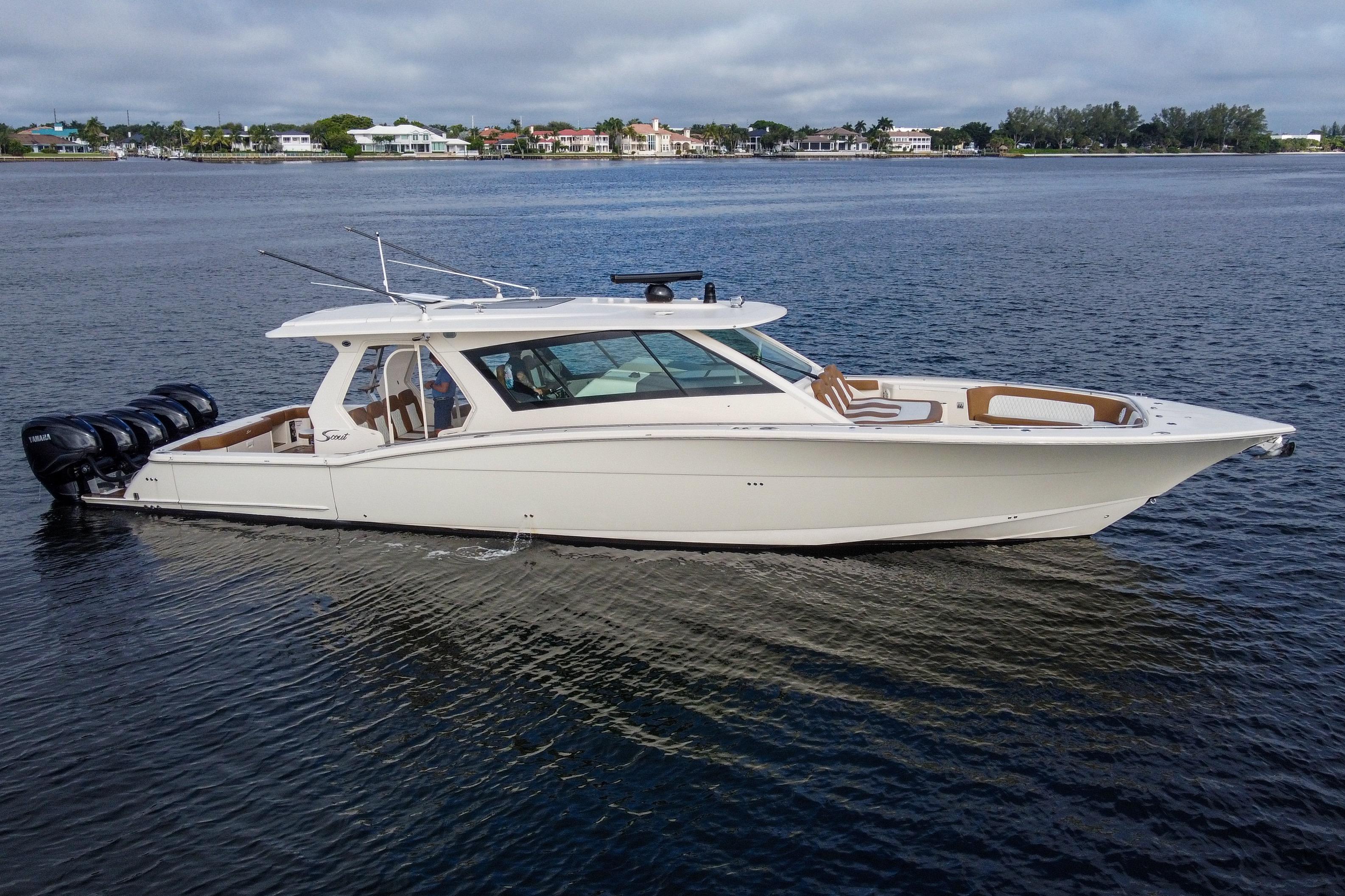 Scout 530 LXF 2020 Scout 530 LXF luxury boat on calm water, showcasing sleek design and powerful engines.