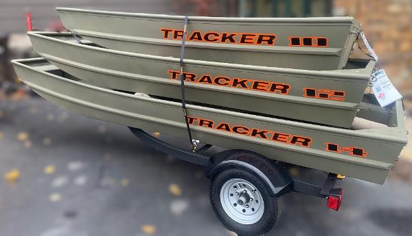 Tracker Grizzly 1436 Utility 2025 Tracker Grizzly 1436 Utility boats stacked on a trailer.