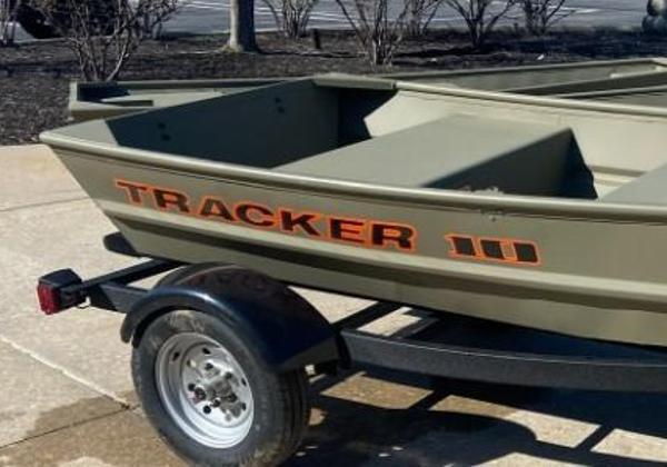 Tracker Grizzly 1036 Utility 2025 Tracker Grizzly 1036 Utility boat on trailer, parked outdoors.