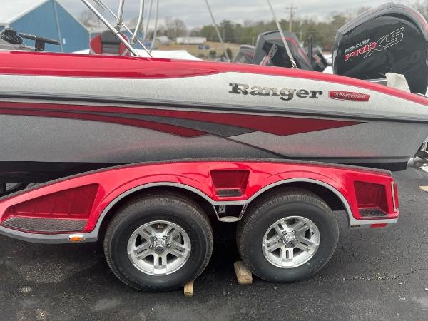 Ranger 1850MS 2023 Ranger 1850MS boat with dual-axle trailer, red and silver color scheme.