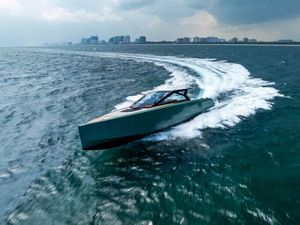 Wally WALLYPOWER 58X 2024 Wally WALLYPOWER 58X yacht cruising on open water with city skyline in background.